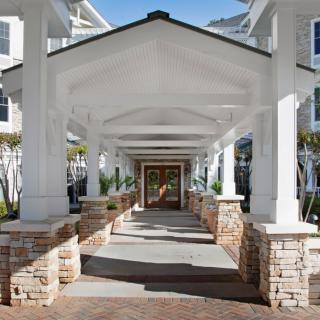A covered walkway leading to the entrance of a building.