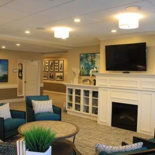 A cozy living room featuring a fireplace and comfortable seating.