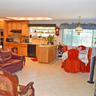 A cozy open-plan living space combining the kitchen and dining area.
