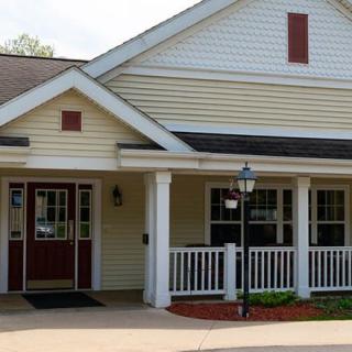A residential building with a front porch and entrance.