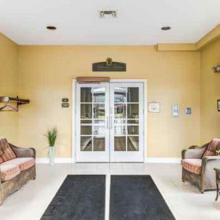 A welcoming lobby with double doors and comfortable seating.