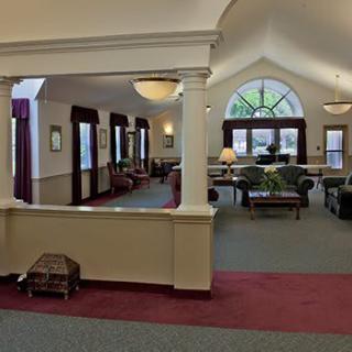 Spacious living area with comfortable seating and large windows.