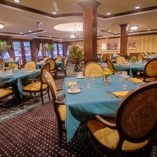 Elegant dining area with beautifully set tables and classic d�cor.