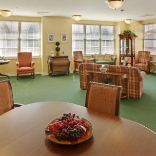 A cozy living room with comfortable seating and ample natural light.