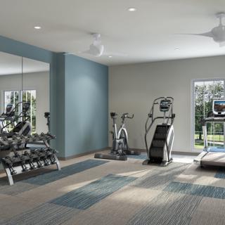 A modern gym with exercise equipment including treadmills, stationary bikes, and weights.