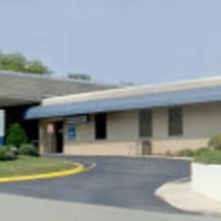 A healthcare facility with an entrance and driveway.