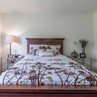 A cozy bedroom with a floral bedspread and matching decor.