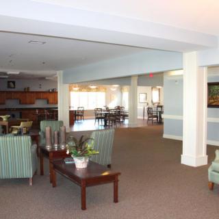 A spacious lounge area with comfortable seating and decor.