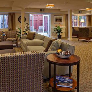 A spacious and well-decorated lobby area with comfortable seating and modern furnishings.