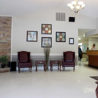 A welcoming waiting area with comfortable chairs and decorative artwork.