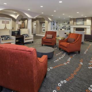 A modern living room with comfortable seating and stylish decor.