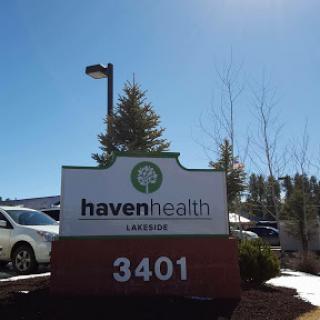A sign for Haven Health located at 3401, under a clear blue sky.