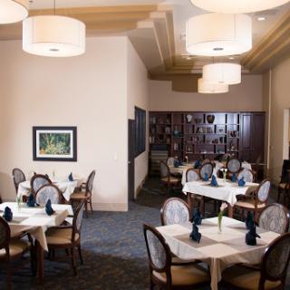 A beautifully designed dining area with elegant tables and ambient lighting.