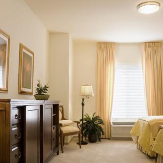 A cozy bedroom with warm lighting and elegant decor.