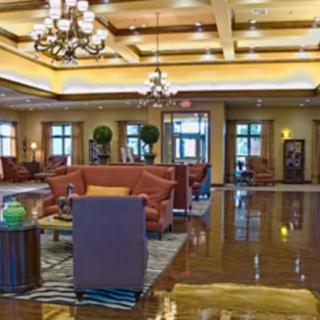 A luxurious hotel lobby with elegant chandeliers and comfortable seating arrangements.
