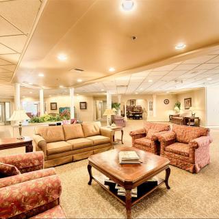 A spacious and well-lit lobby with comfortable seating arrangements and tasteful decor.