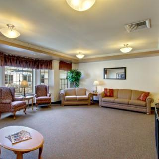 A cozy living room with comfortable seating and natural light.