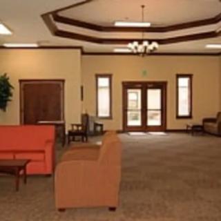 A spacious lobby with comfortable seating and elegant lighting.