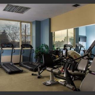 A well-equipped indoor gym featuring treadmills and stationary bikes.