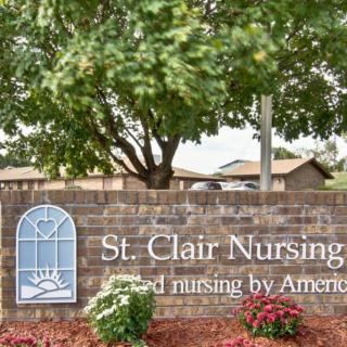 Entrance sign for St. Clair Nursing Home with surrounding landscaping.