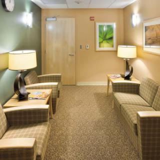 A calm and inviting waiting room with comfortable seating and soft lighting.