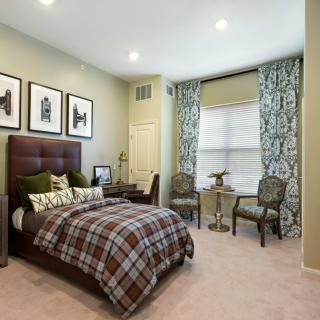 A modern bedroom with stylish decor and comfortable furnishings.