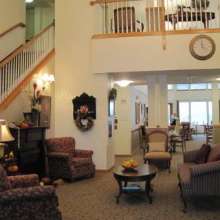 A spacious living room with comfortable seating and elegant decor.