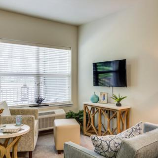 A modern living room with comfortable seating and stylish decor.