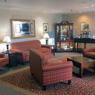 A cozy living room with sofas, a coffee table, and decorative elements.