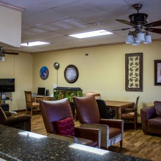 A cozy lounge area featuring comfortable seating and a warm atmosphere.