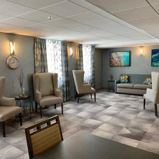 A modern waiting room with comfortable seating and stylish decor.