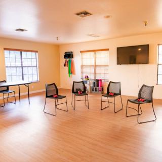An inviting meeting space with chairs arranged in a circle.