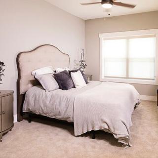 A cozy, modern bedroom with a comfortable bed and elegant decor.