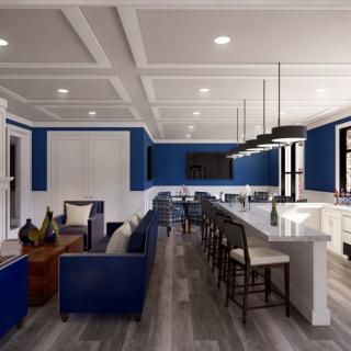 A spacious open-concept living area with a modern kitchen and stylish blue accents.