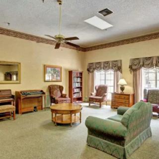 A cozy living room with comfortable seating and classic decor.