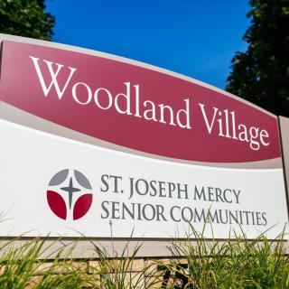 Sign for Woodland Village, a St. Joseph Mercy Senior Community.