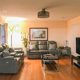 A cozy living room with comfortable seating and modern decor.