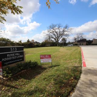 A view of the architectural firm located at 511, featuring a well-maintained lawn and clear skies.