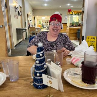 A joyful moment at a restaurant, capturing the festive spirit with holiday decorations.