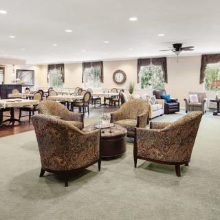 A spacious living room with comfortable seating and elegant decor.