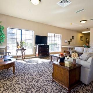 A cozy living room with modern furniture and abundant natural light.