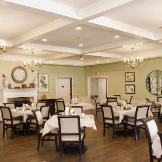 A cozy and elegantly designed dining area with well-set tables, perfect for a comfortable dining experience.