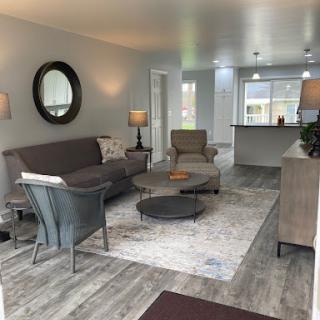 A cozy and modern living room featuring stylish furniture and a welcoming atmosphere.