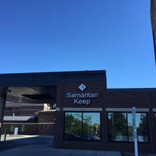 The exterior of Samaritan Keep under a clear blue sky.
