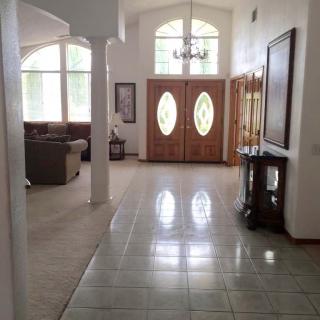 A spacious home entrance with a view of the living area.