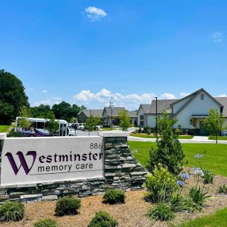 Westminster Memory Care facility with landscaped surroundings and clear signage.
