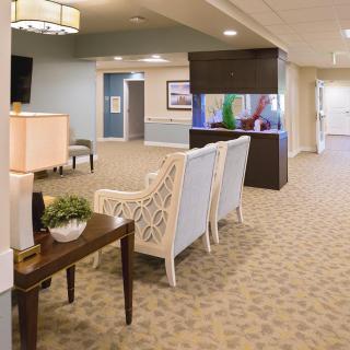 A spacious and elegantly decorated lobby area featuring comfortable seating and tasteful decor.