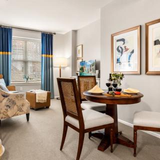 A cozy living and dining area with elegant furniture and decor.
