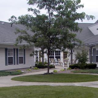 A suburban house with a well-maintained garden and pathway.