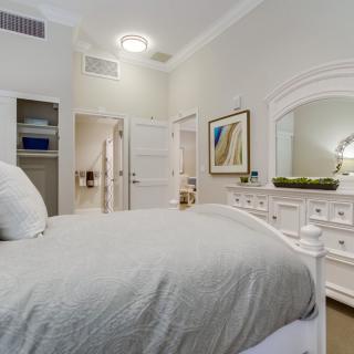 A cozy bedroom with elegant furniture and soft lighting.